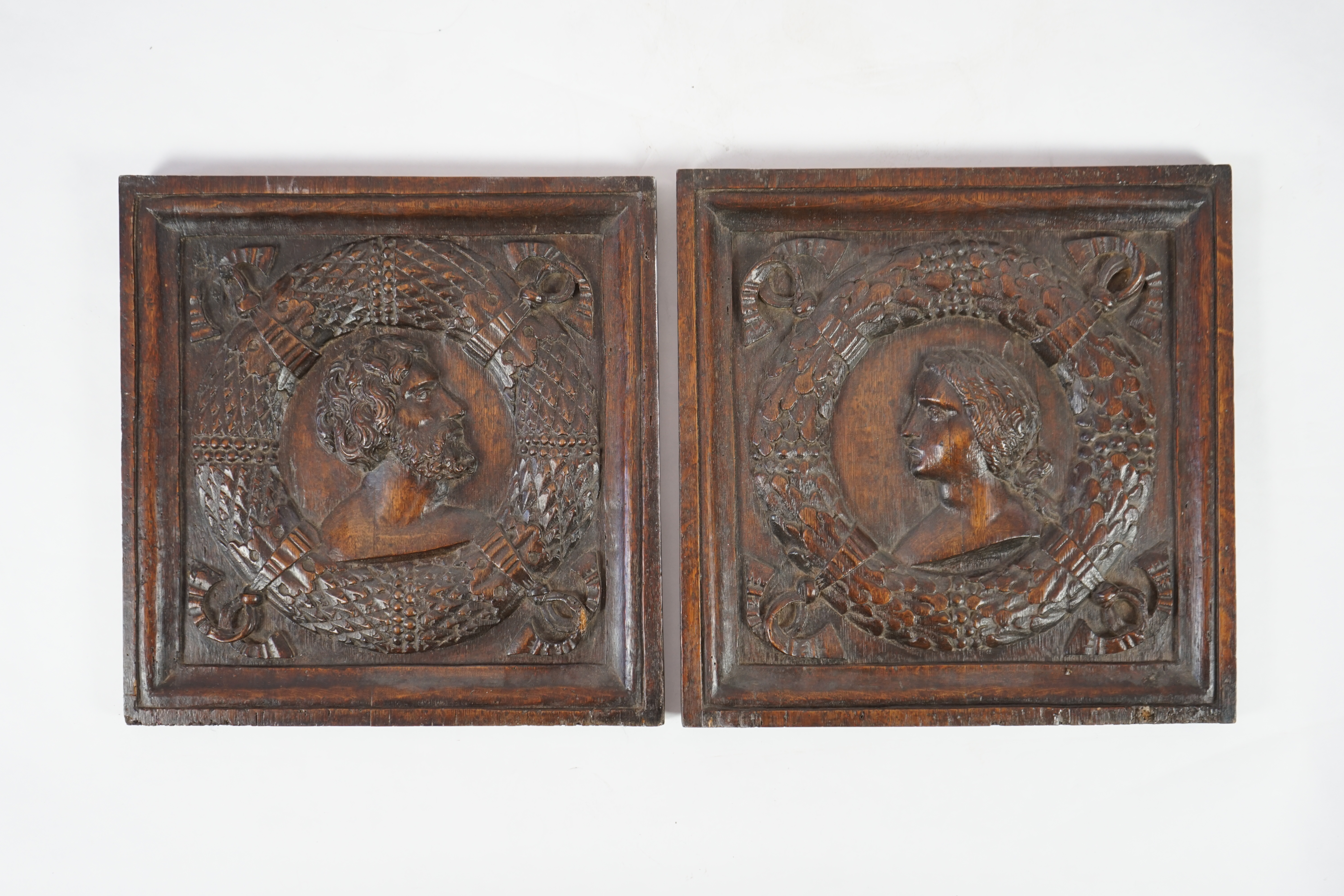 A pair of 17th century carved oak panels